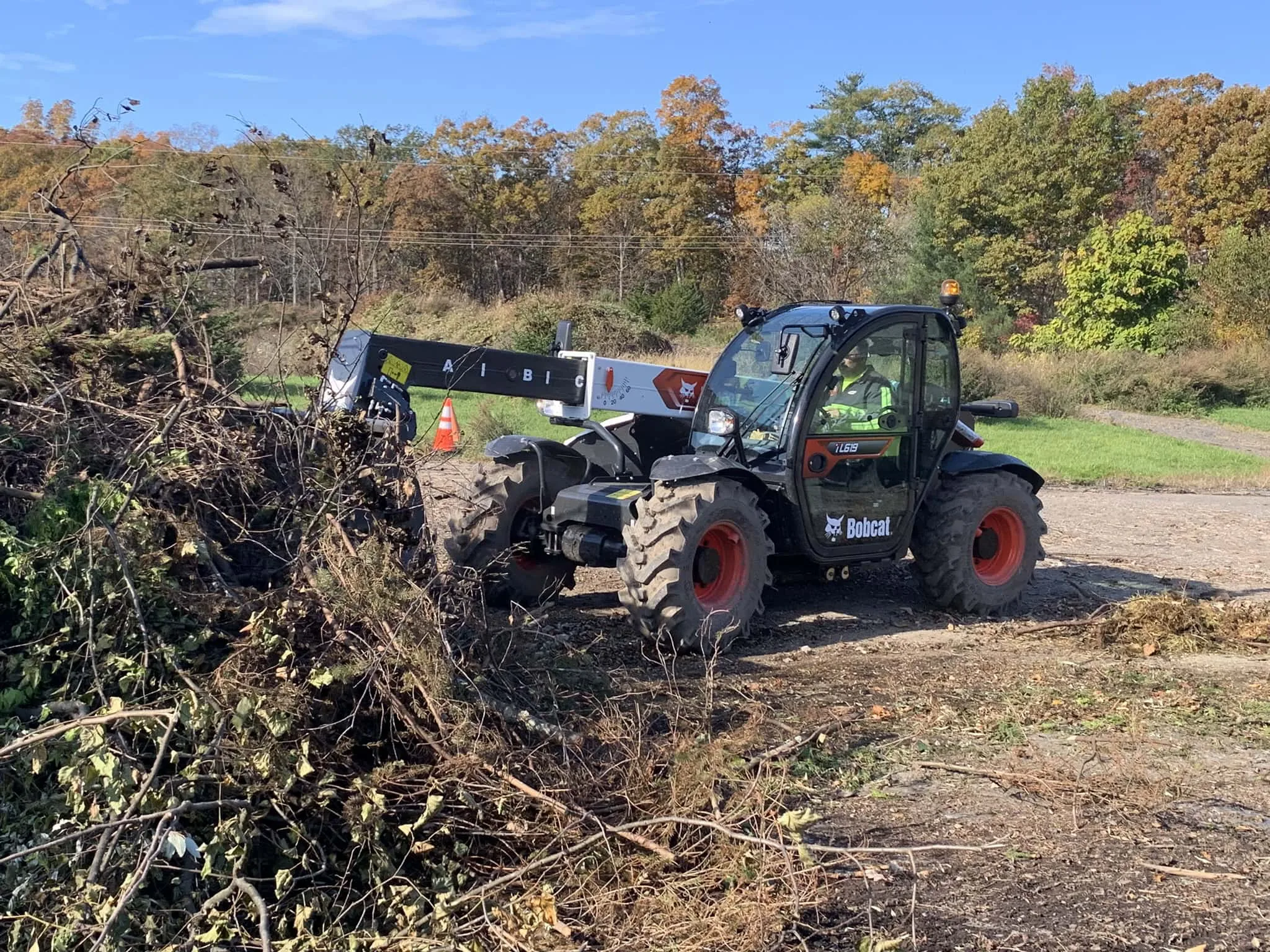 Bobcat TL619 Telehandler moving debris